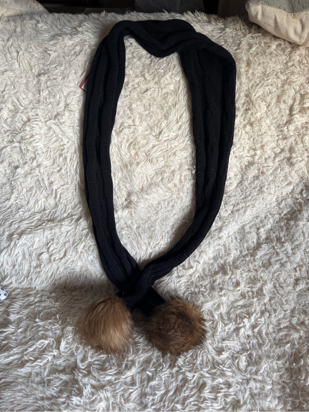 Chic Black Knit Scarf with Brown Faux Fur Pom-Poms